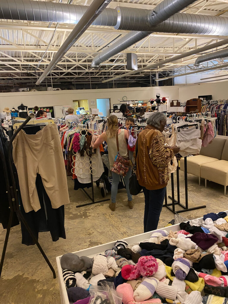 people shopping donated clothes