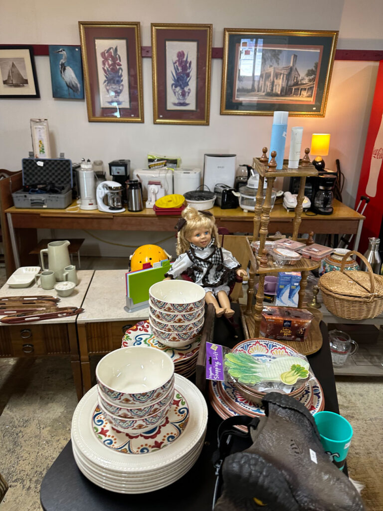 dishes, doll, other kitchen items at the Totally Thrifty Thrift Store in Shelby
